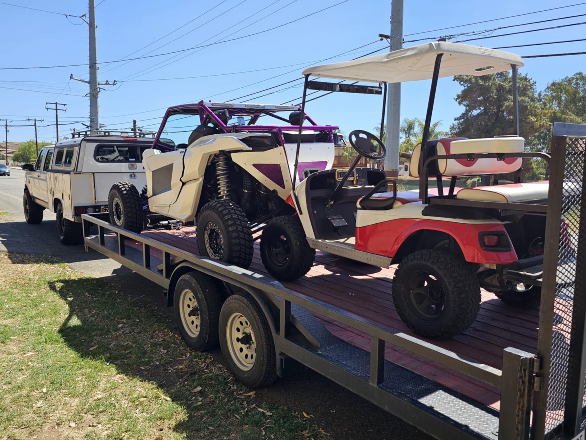 20 foot utility trailer carrying a side by side and golf cart near Wildomar CA